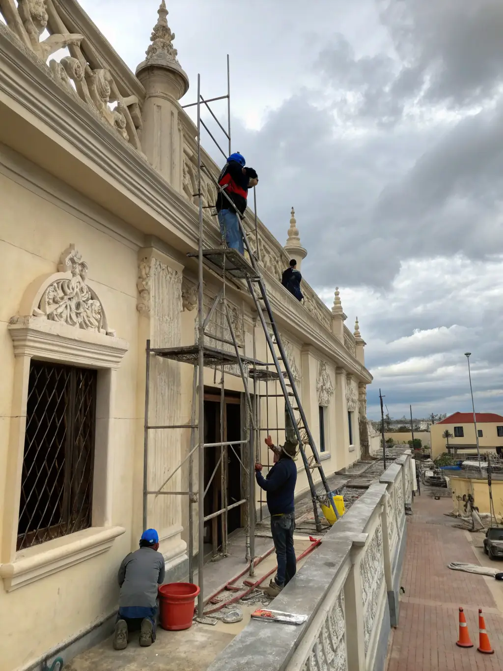 A high-quality photo of the Château de Chantemille's main facade, showcasing ongoing restoration work on the stonework, with scaffolding visible.